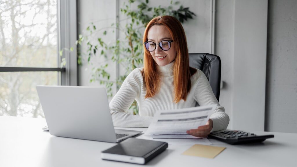 Woman with KPI document in hand